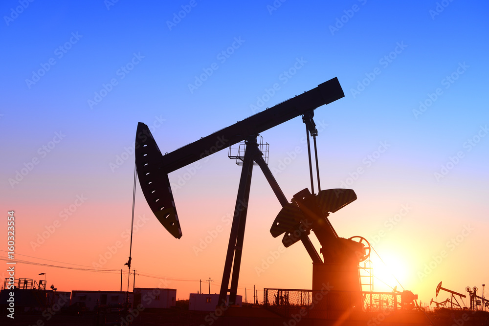 Pumping unit is working, under the sunset