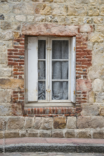 Old house window in brick