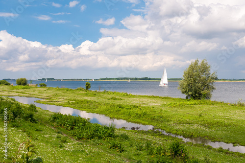 Sailboats on Haringvliet estuary and Tiengemeten island, Netherlands photo