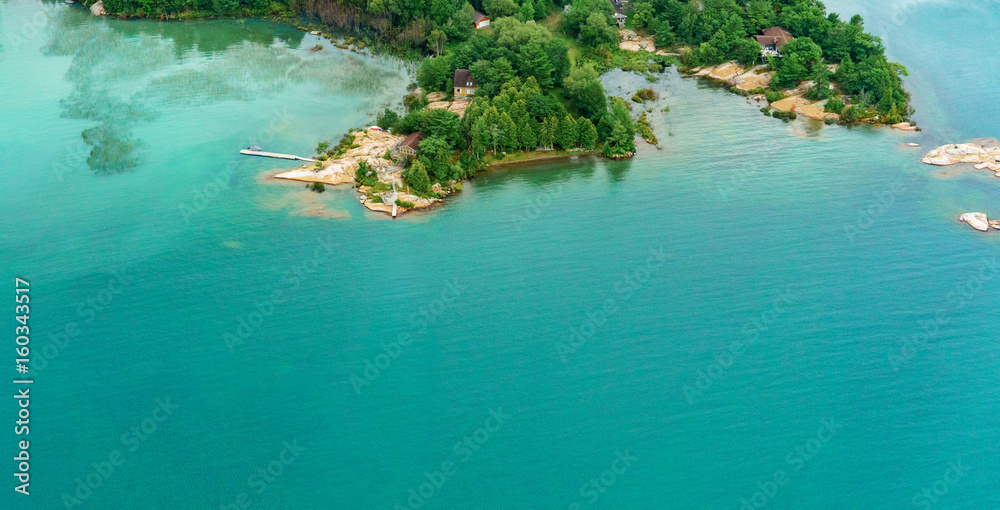 High angle view of coastline with offshore rocks and trees, Toronto, Ontario, Canada.