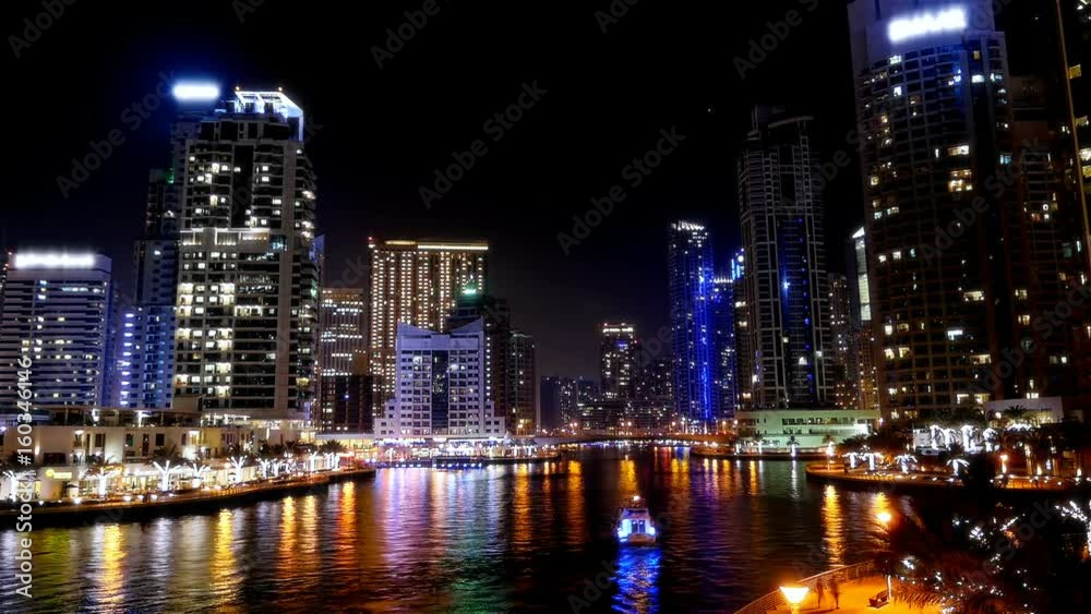 Night time lapse with boats and people in Dubai Marina Night time lapse with boats and people in Dubai Marina