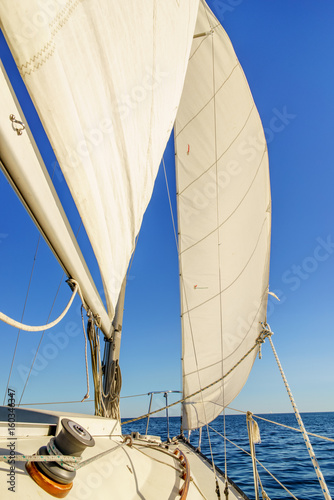 Sailboat with sail and clear blue sky, Toronto, Ontario, Canada.