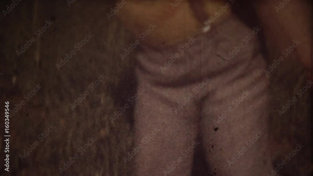 Family Chronicle: Little boy crying. Father shooting family video on 8mm camera
