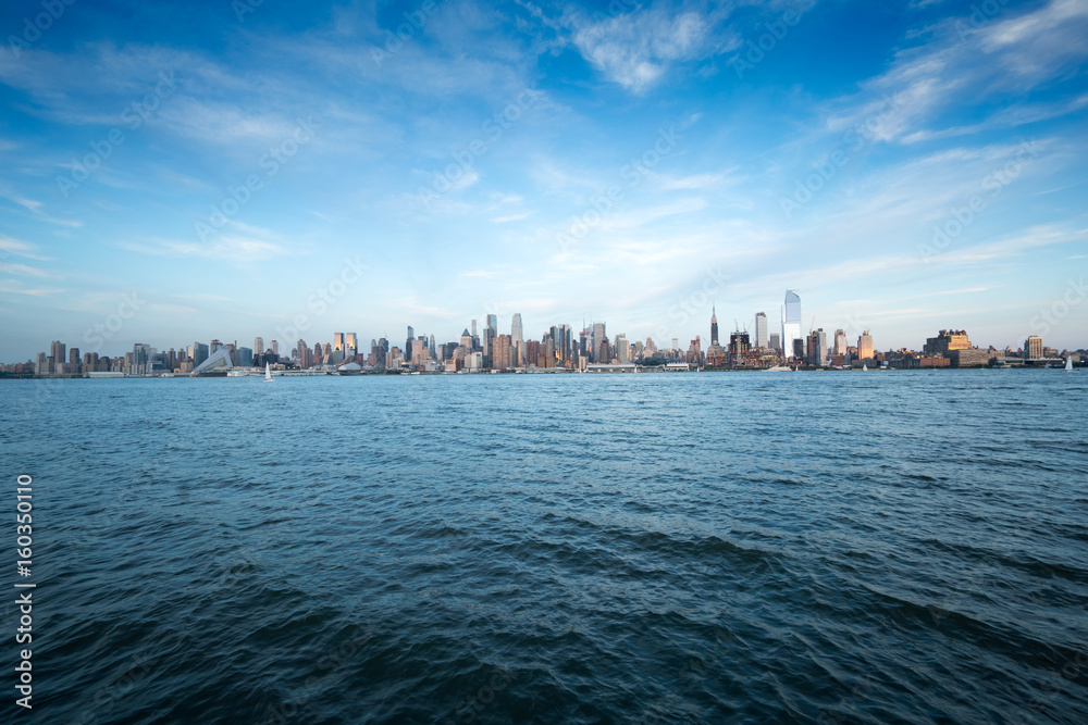 Naklejka premium View of New York city across the water, New York, USA.