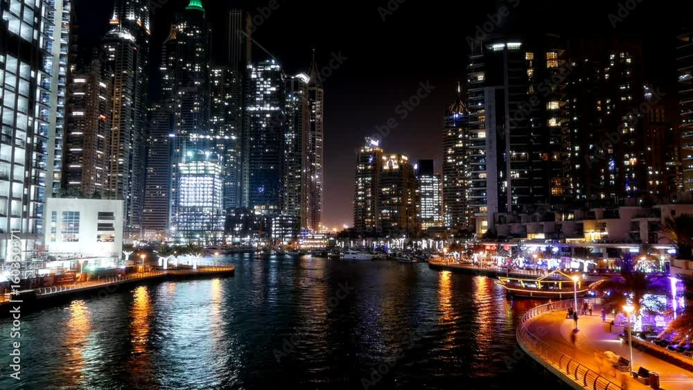 Night time lapse with boats and people in Dubai Marina Night time lapse with boats and people in Dubai Marina