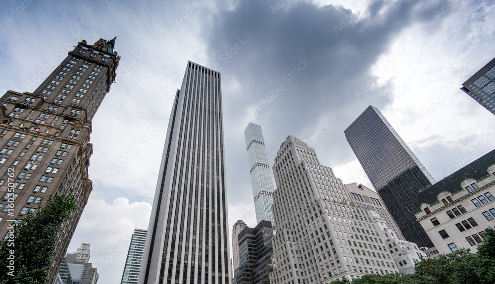 Low angle view of tall skyscrapers in New York City, New York, USA.