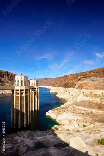 Small building and water with rocks, Hoover dam on the Colorado river, USA. colour picture from nevada usa 2017