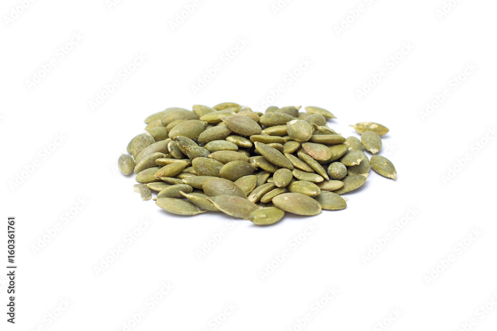 Roasted pumpkin kernels isolated on white background Roasted pumpkin kernels isolated on white background