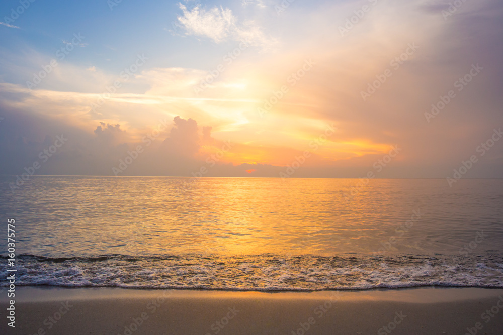 Beautiful sky, sunrise and waves at the beach Beautiful sky, sunrise and waves at the beach