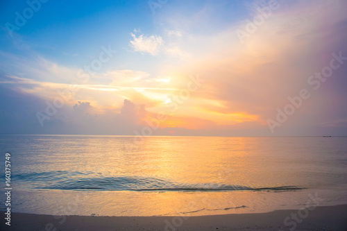 Beautiful sky, sunrise and waves at the beach © apichon_tee