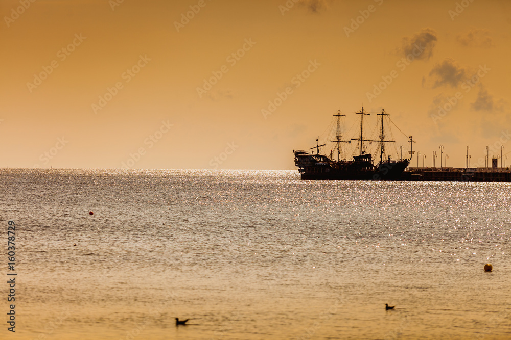 Old pirate ship in the sea.