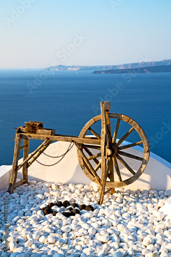 greece in santorini the old town near mediterranean sea and spinning wheel