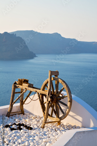 greece in santorini the old town near mediterranean sea and spinning wheel