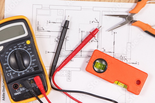 Electrical diagrams, multimeter for measurement in electrical installation and accessories for engineer jobs