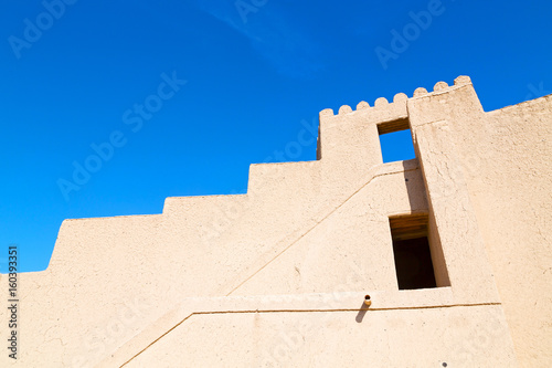 in oman    muscat    the   old defensive  fort battlesment sky and  star brick