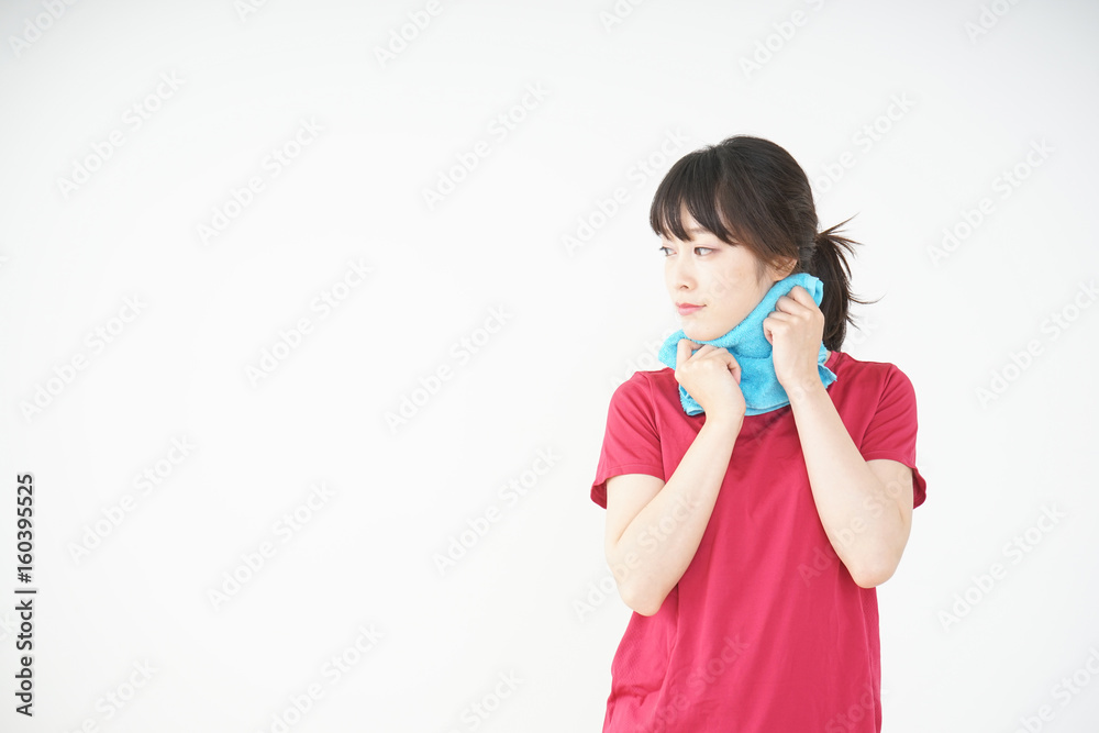 Young woman drying the sweat during sport Young woman drying the sweat during sport