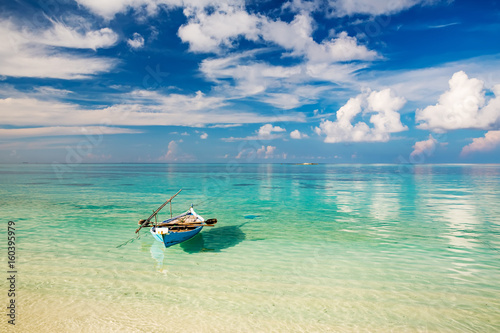 Beautiful ocean beach and boat on Maldives