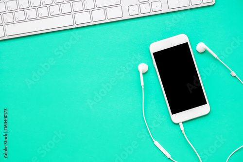 Top view of mobile phone with headphone