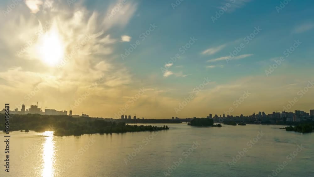 Spectacular sunset over the river and skyscrapers in the background
Spectacular sunset over the river and skyscrapers in the background