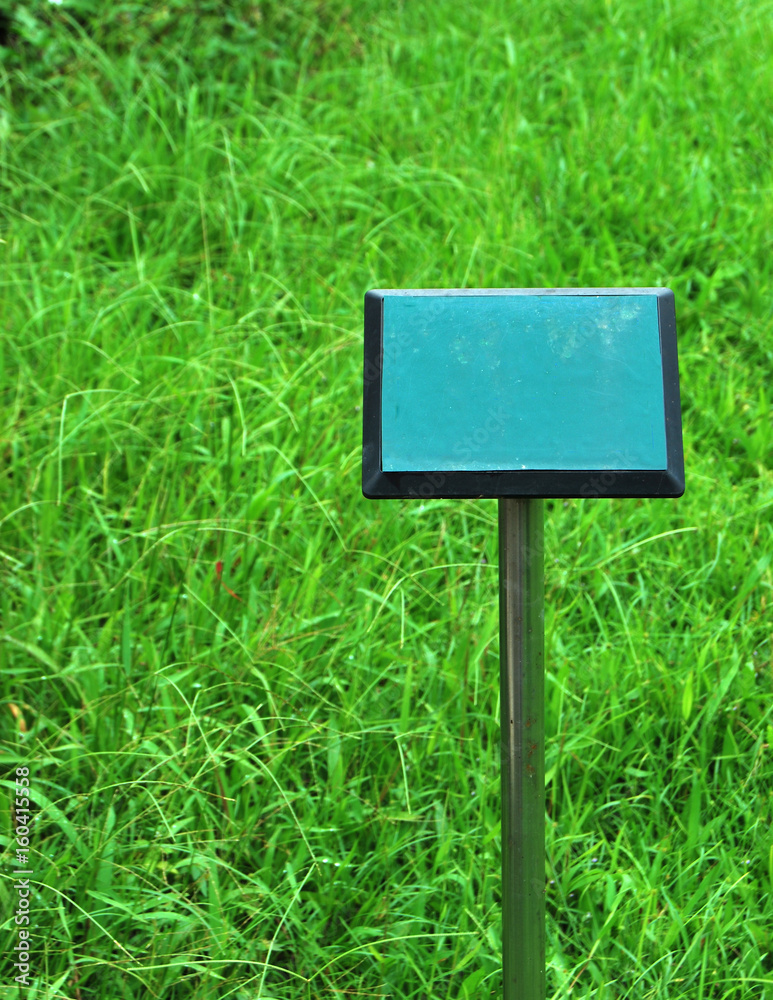  Explanatory sign on grass field in a garden
