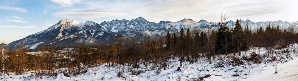 Panorama of mountain peaks covered with fresh snow.