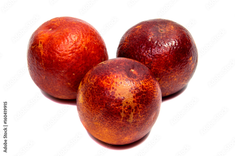 Half of bloody orange with leaf isolated on a white background Half of bloody orange with leaf isolated on a white background