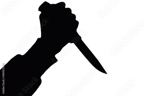 Isolated human hand with killing knife silhouette (shadow) on white background. Graphic resources for designers and criminal news and chronicles.
