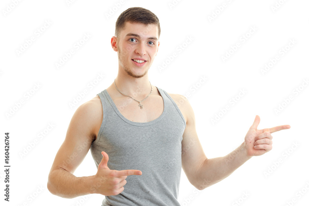 hilarious charming guy shows his hands and smiling hilarious charming guy shows his hands and smiling