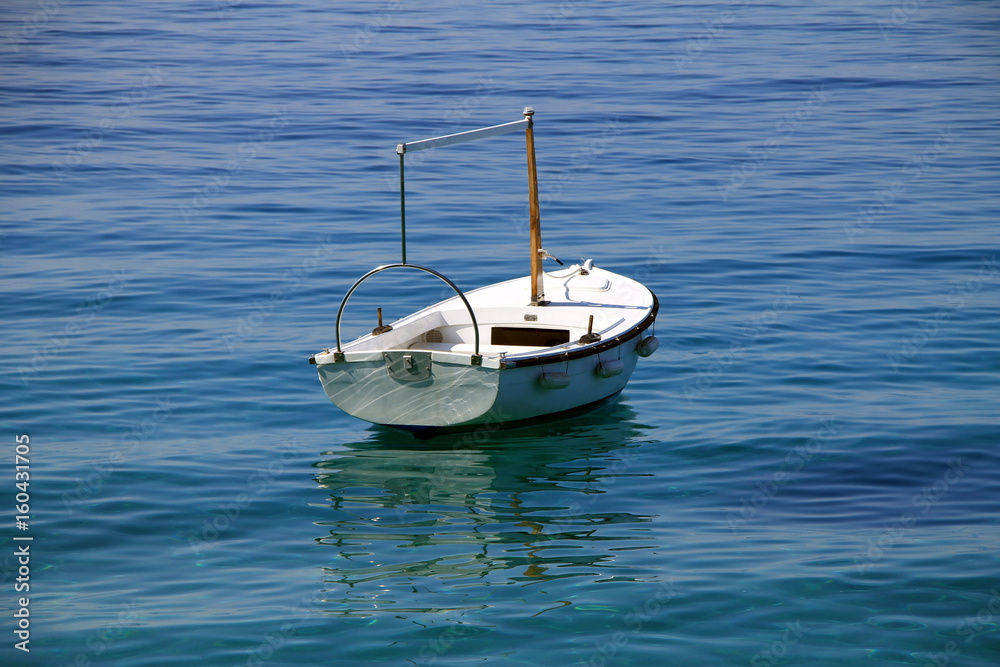Small white boat in Adriatic sea , Croatia Small white boat in Adriatic sea , Croatia
