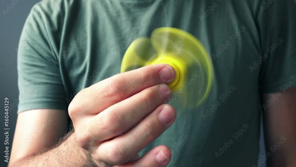 Fidget spinner in male hand