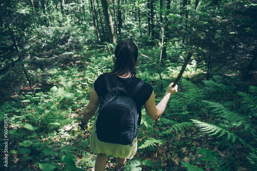 traveler woman hiking in woods