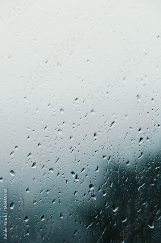Dirty glass of raindrops, background
