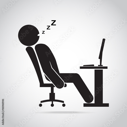 Man sleeping front of computer on work table
