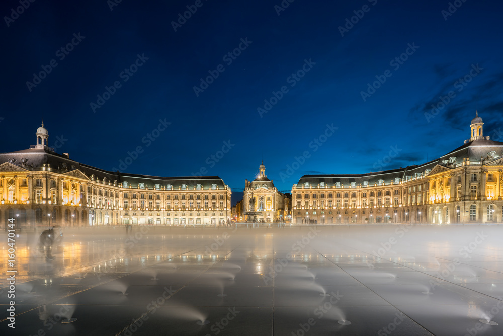 Place De La Bourse with artificial mist from fountain mechanism and reflection in Bordeaux , France