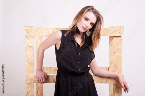 Blonde model posing fashion in studio photo on white background. Beautiful model. Glamour and sensuality. Fashionable