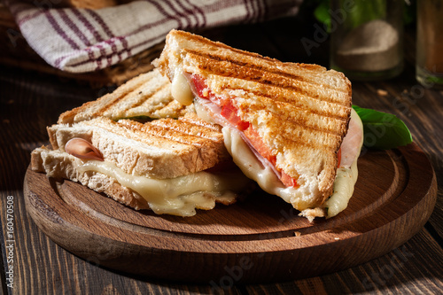 Panini with ham, cheese and lettuce sandwich