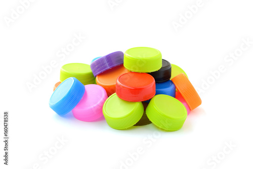 pile of colorful plastic bottle cap on white background
