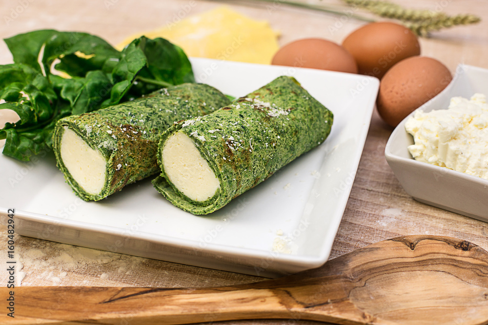 crepes stuffed with spinach and fresh cheese crepes stuffed with spinach and fresh cheese