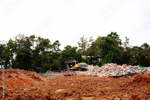 Excavator or backhoe at the construction site, reservoir construction