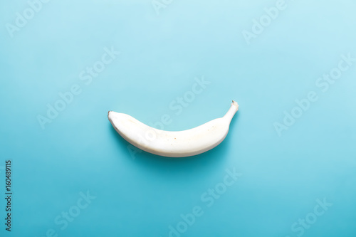 White banana on pastel blue background. Minimal fashion, flatlay , top view. Albino Different Creativity Creative Thinking Ideas Concept photo