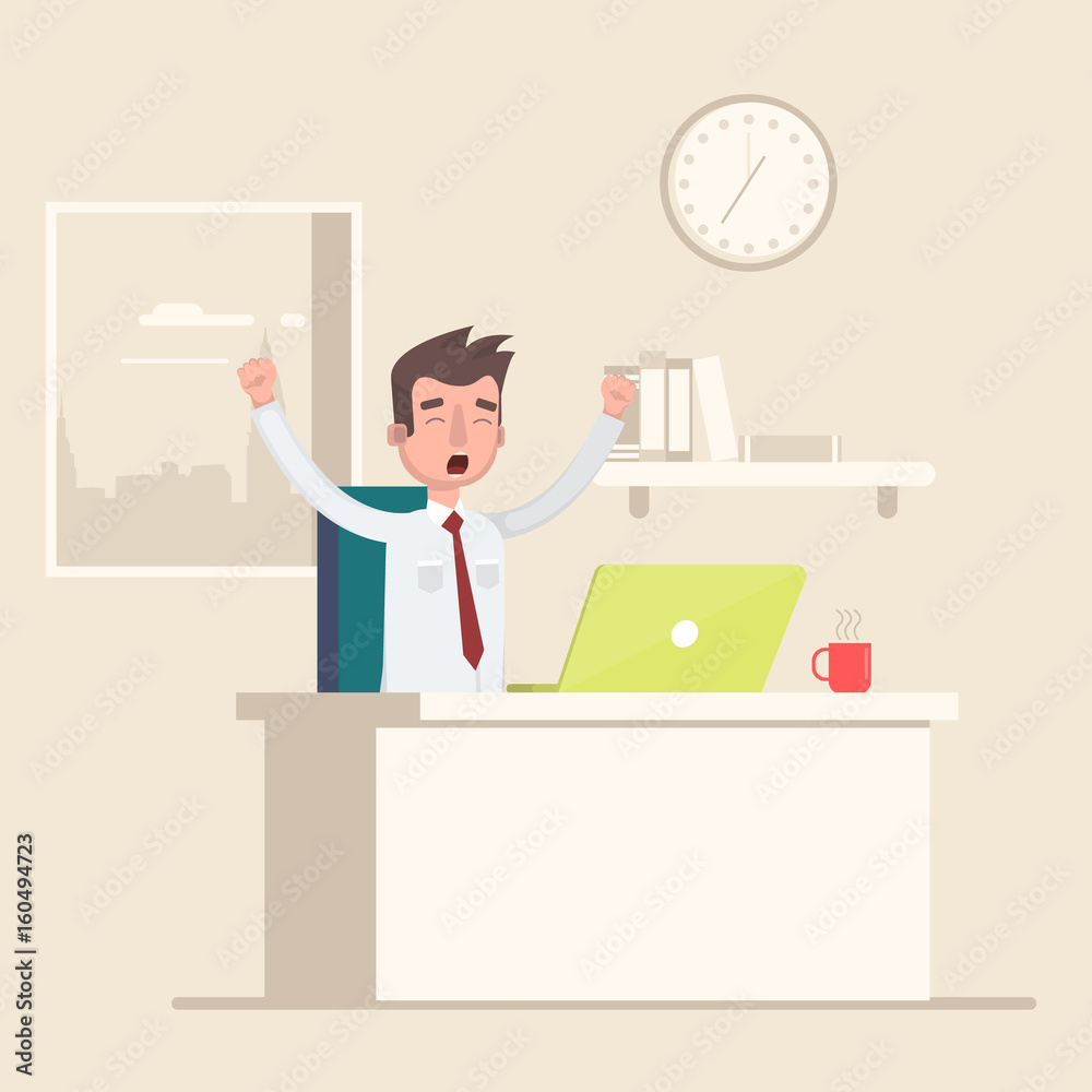 A man sits in the workplace in the office and yawns. A man sits in the workplace in the office and yawns.