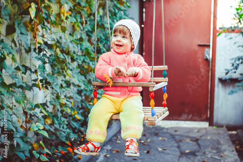 Child on the swing photo