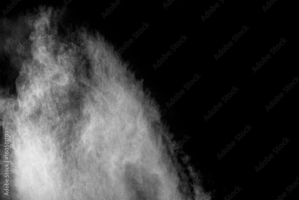 Powder explosion. Closeup of white particle explosion isolated on black background Powder explosion. Closeup of white particle explosion isolated on black background