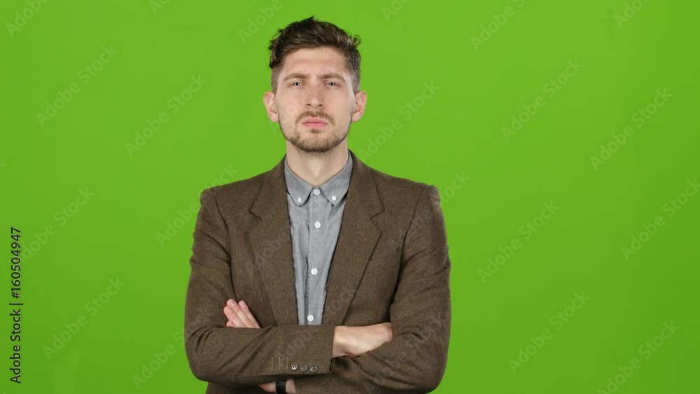 Businessman reflects on the correctness of the decisions he made. Green Screen Businessman reflects on the correctness of the decisions he made. Green Screen