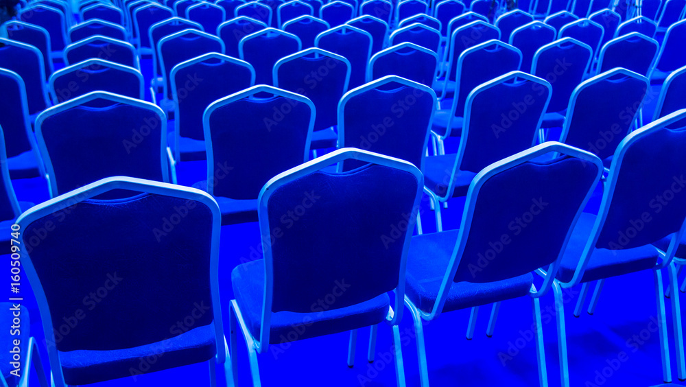 Obraz premium Rows of blue chairs. The chairs are blue. Many chairs.