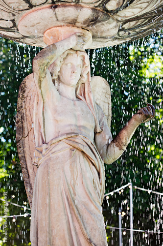 Statue woman waterfall Dublin Iveagh Garden park photo