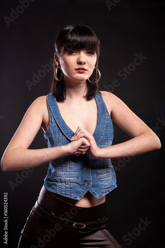 Attractive woman posing in fashion style in studio photo. Beauty and fashion. Stylish brunette
