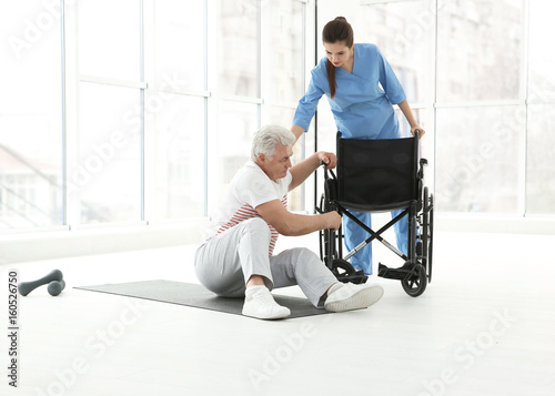 Senior disabled man with yo...