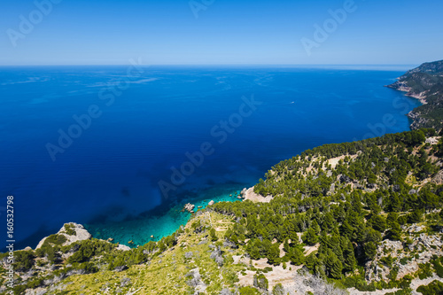 Beautiful travel landscape of Mallorca island of Spain on a sunny day a blue sky and azure sea near stony rocks