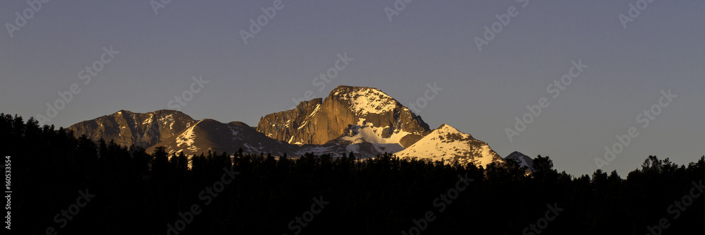 Dawn light on iconic Long's  Peak, 14,259' elevation, the tallest mountain in Rocky Mountain National Park